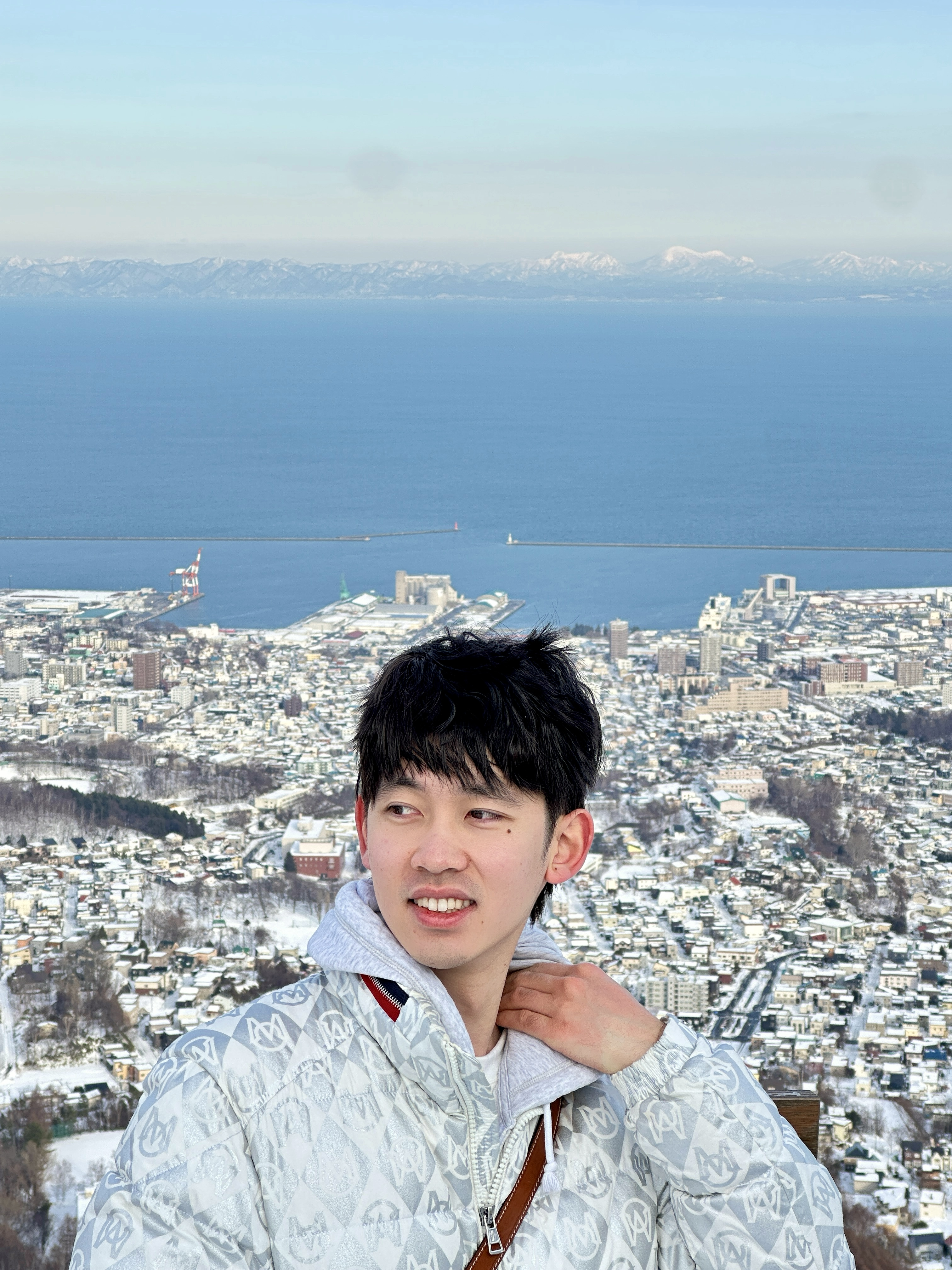 Sifan Tao overlooking a winter cityscape